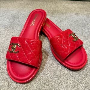 Chanel patent leather red slides. Stunning! Sold out everywhere. Never worn.
